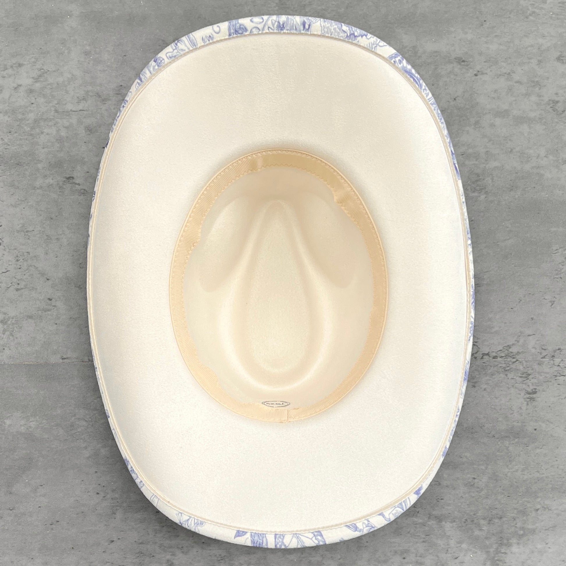 Underside view of ivory cowboy hat