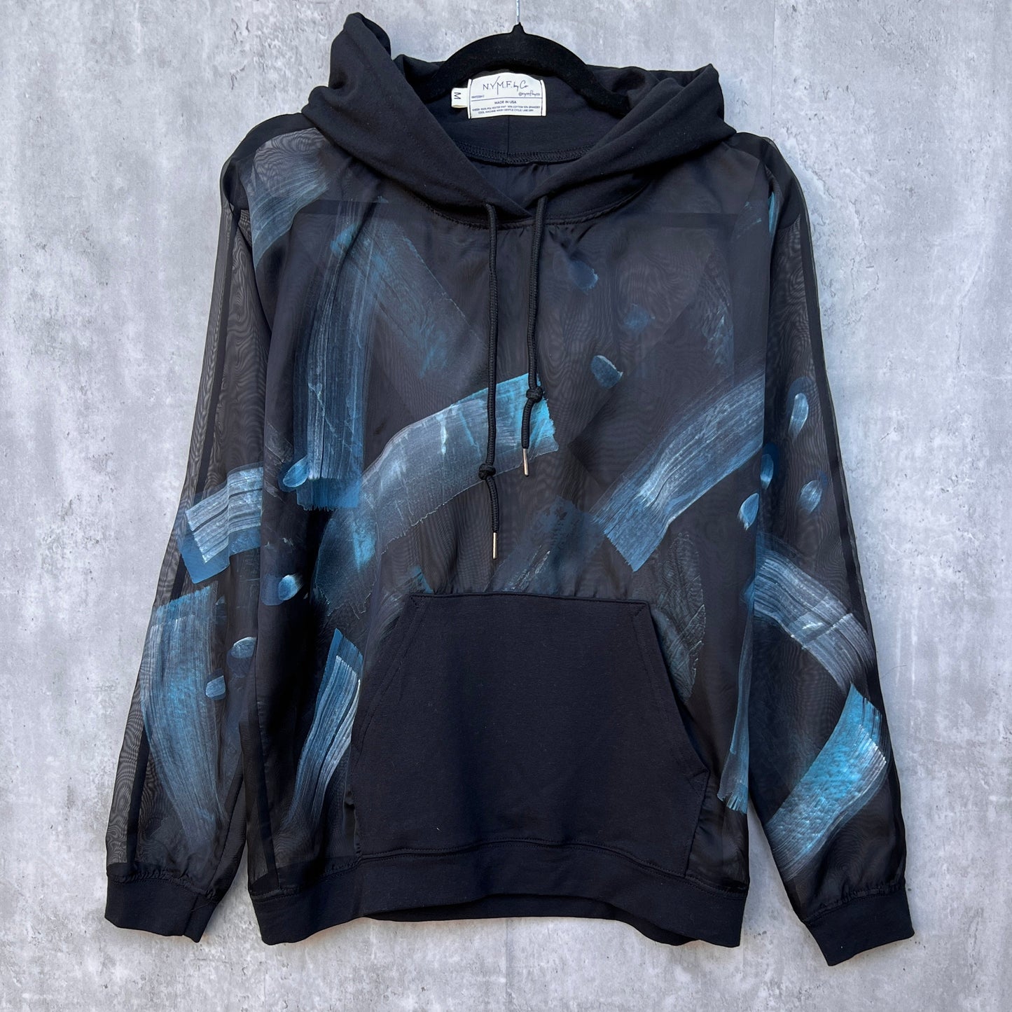 Black sheer hoodie with artwork painted brushstrokes in shades of blue