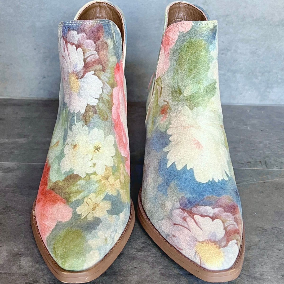 Rococo blue floral ankle boots front view with painterly floral artwork