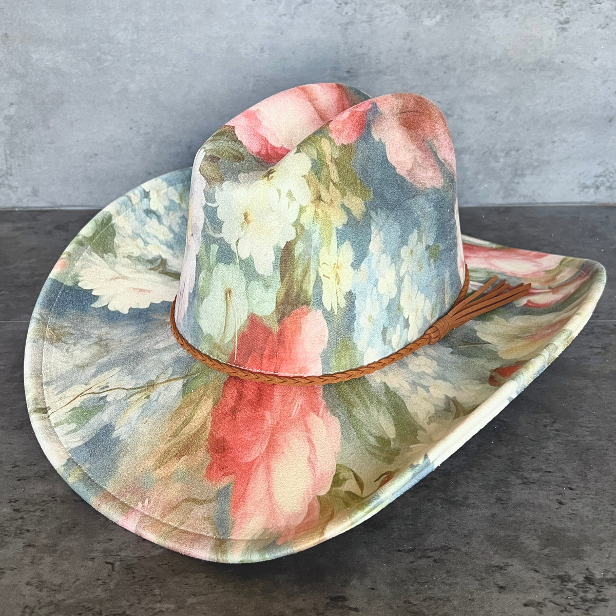 Angled view of blue pink and cream floral cattleman cowboy hat