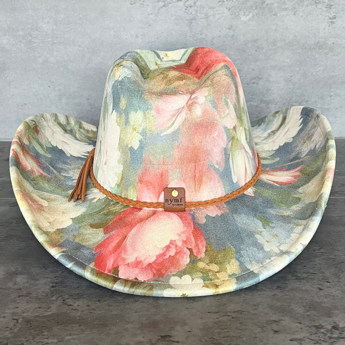Back view of blue floral pinched-front cowboy hat with Nymf logo