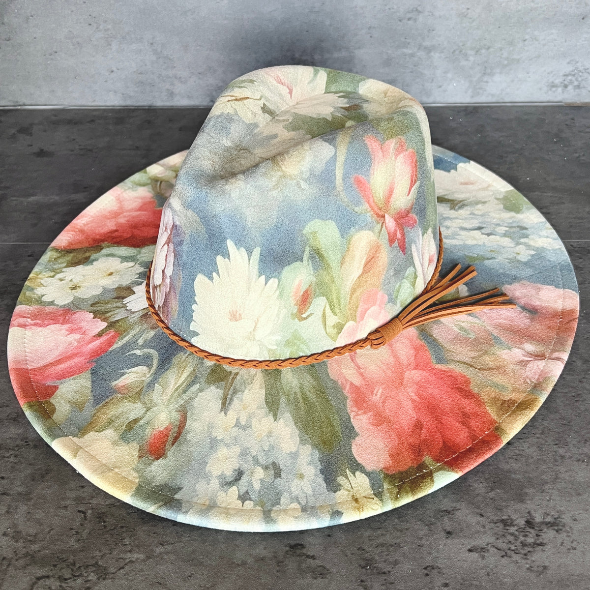 Side view of blue pink and cream floral rancher hat