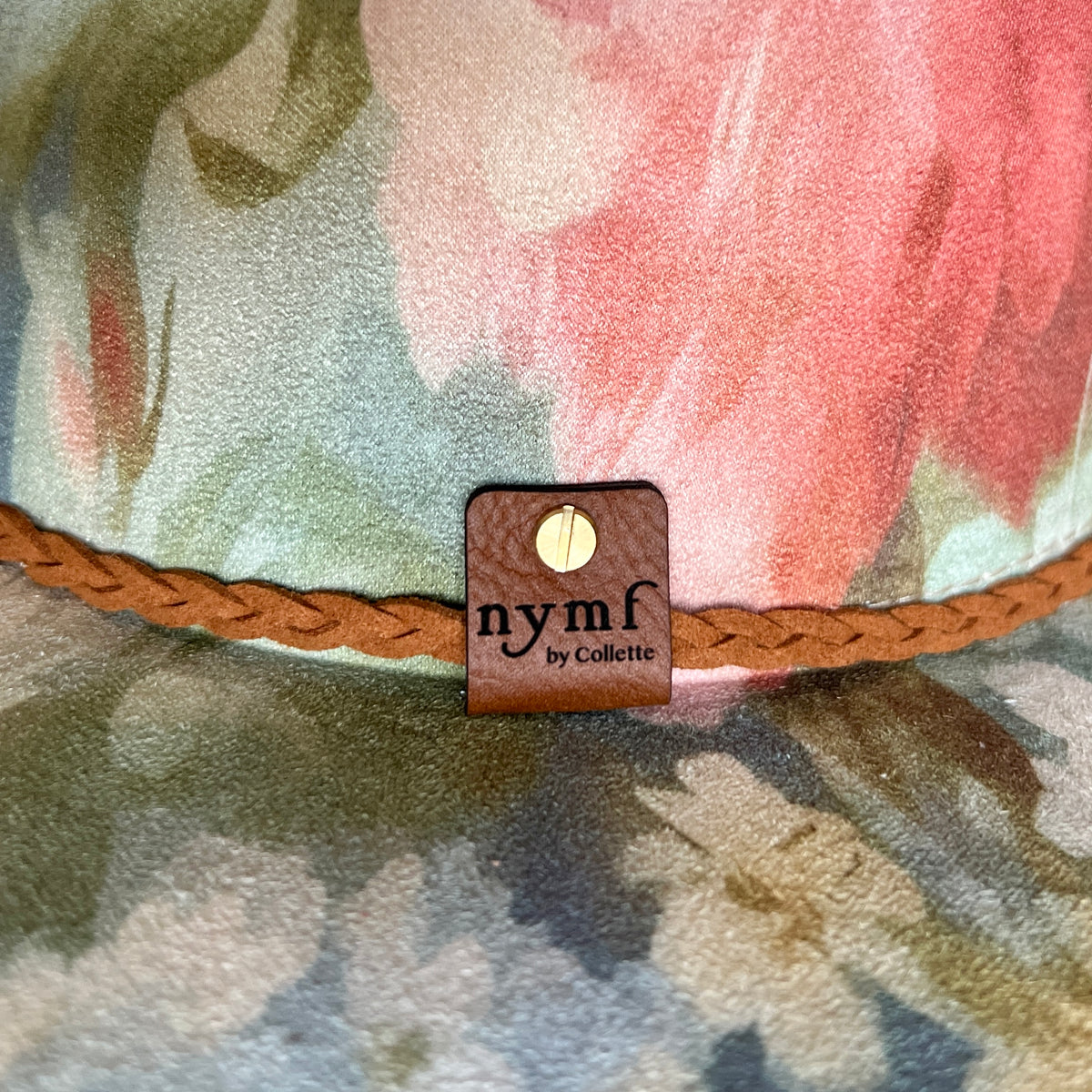 Nymf logo detail on Rococo blue floral rancher hat