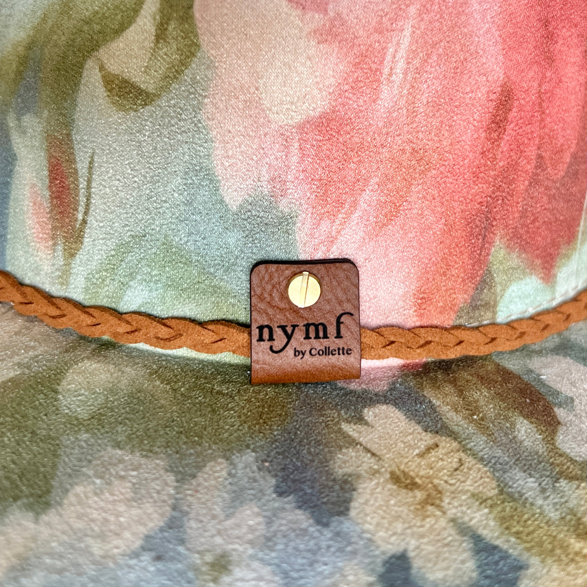 Nymf logo detail on Rococo floral rancher hat