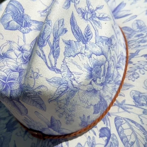 video showing cream cowboy hat with blue florals on model