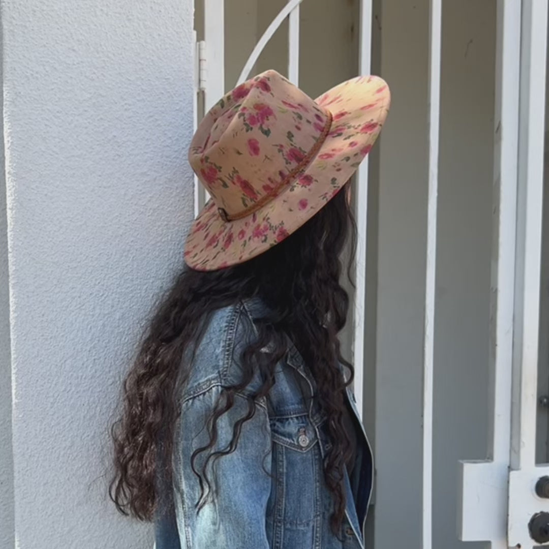Model wearing tan floral hat