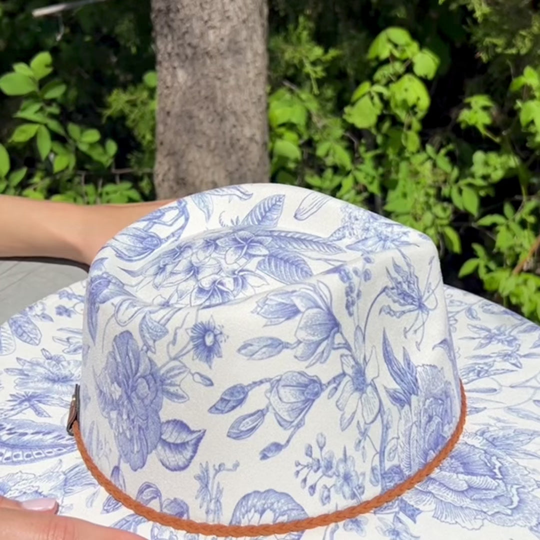 video with blue floral hat on model