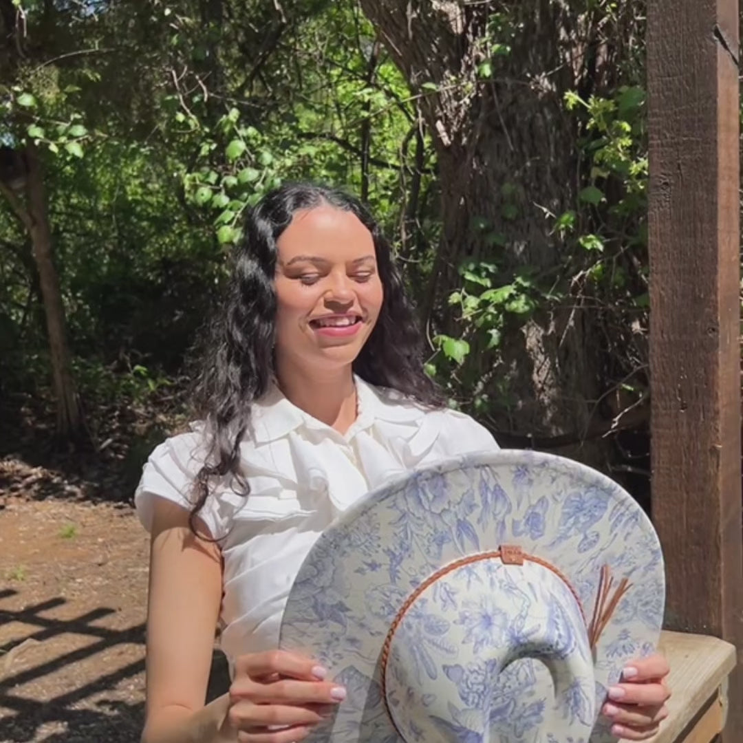 Video of model wearing blue floral Western rancher hat